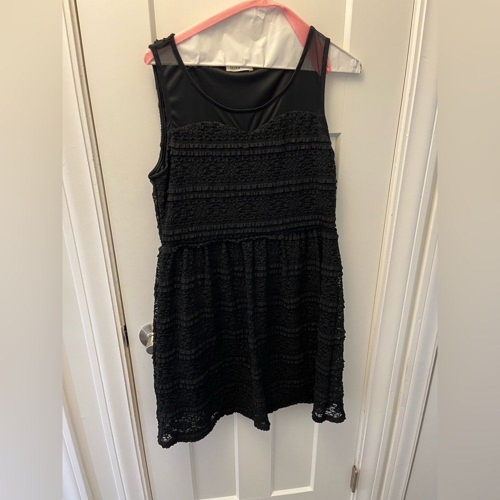 Black dress with sheer shoulders and cute ruffle texture.